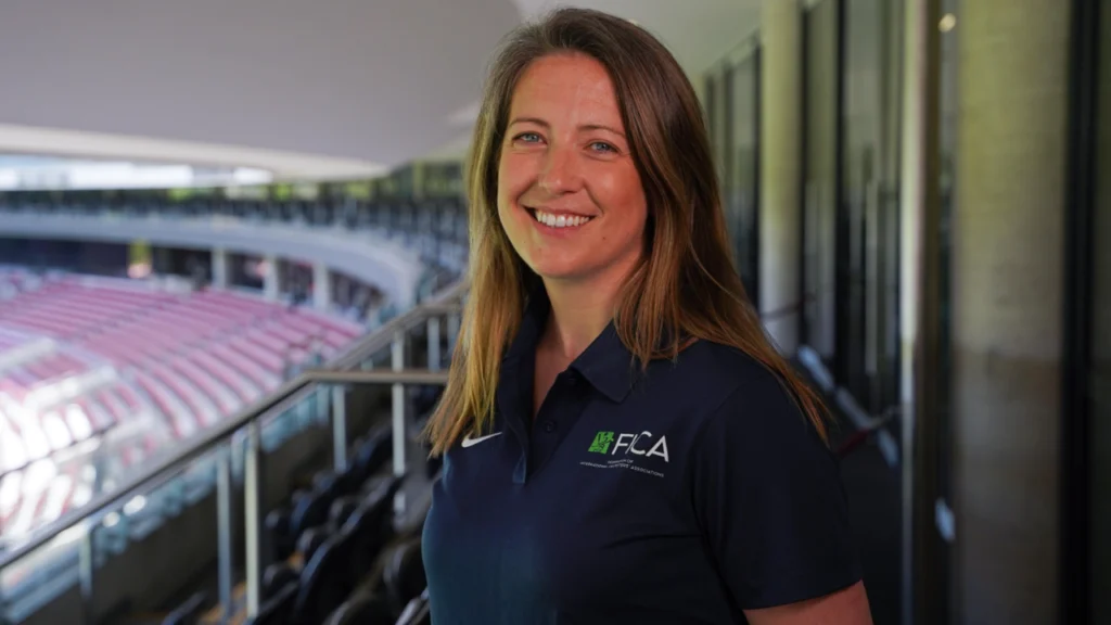 Cecelia Joyce at a cricket venue, highlighting her leadership roles as founding President of the Irish Cricketers’ Association and board member of the World Cricketers’ Association.