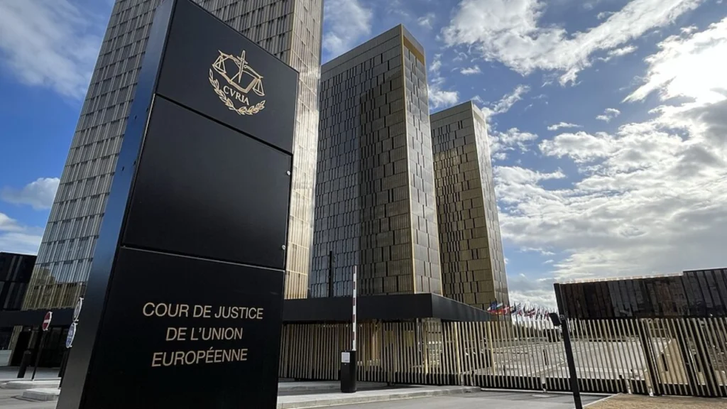 Exterior view of the European Court of Justice building in Luxembourg, headquarters of the Court of Justice of the European Union, under a partly cloudy sky.