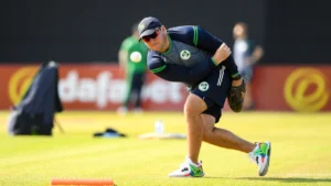 Gary Wilson, Ireland men's cricket head coach, throws a ball during a fielding drill at a team training session.
