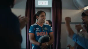India women's cricket captain Harmanpreet Kaur interacts with supporters while wearing the national team jersey during a team event.