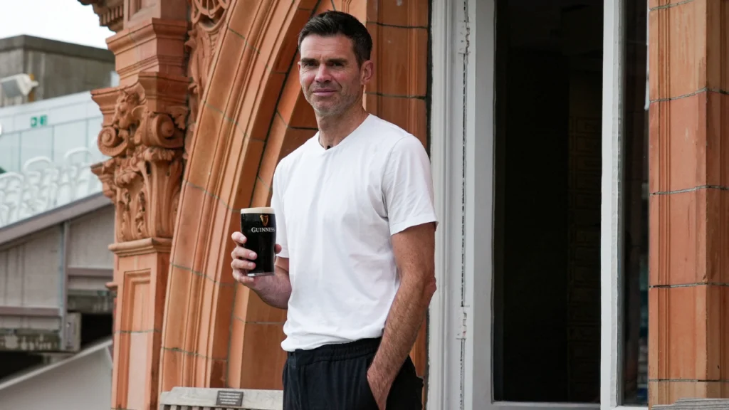 James Anderson holds Guinness and Guinness 0.0 drinks at Lord's Cricket Ground during a promotional event at the iconic cricket venue.