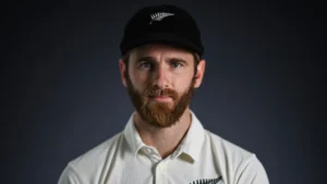 Kane Williamson poses for an official portrait wearing New Zealand cricket team apparel and cap ahead of an international cricket tournament.