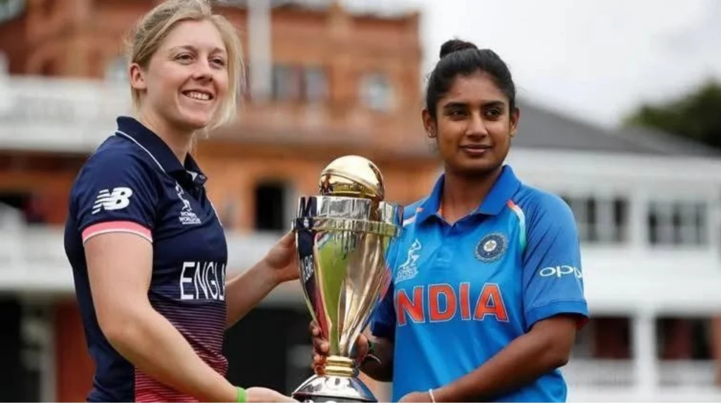 India captain Mithali Raj and England captain Heather Knight pose with the ICC Women's Cricket World Cup trophy ahead of the 2017 Women's World Cup final.