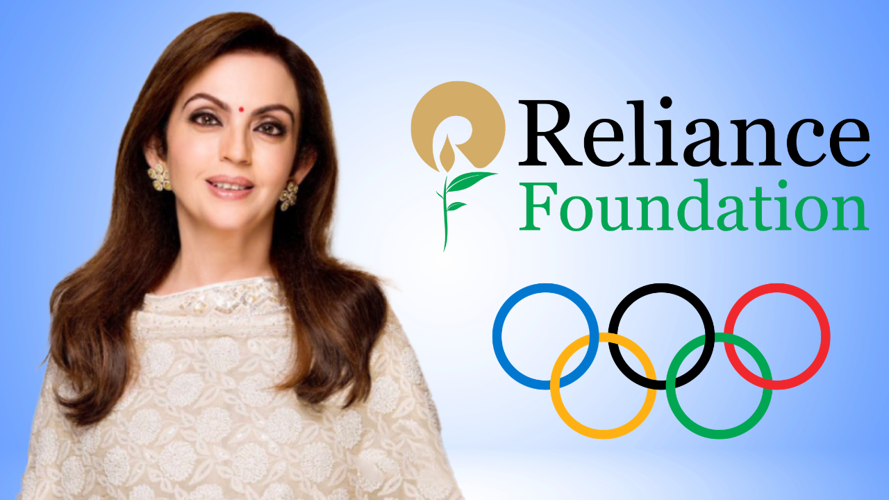Nita Ambani pictured alongside the Reliance Foundation logo and Olympic rings, highlighting her role in promoting sports development and Olympic initiatives in India.