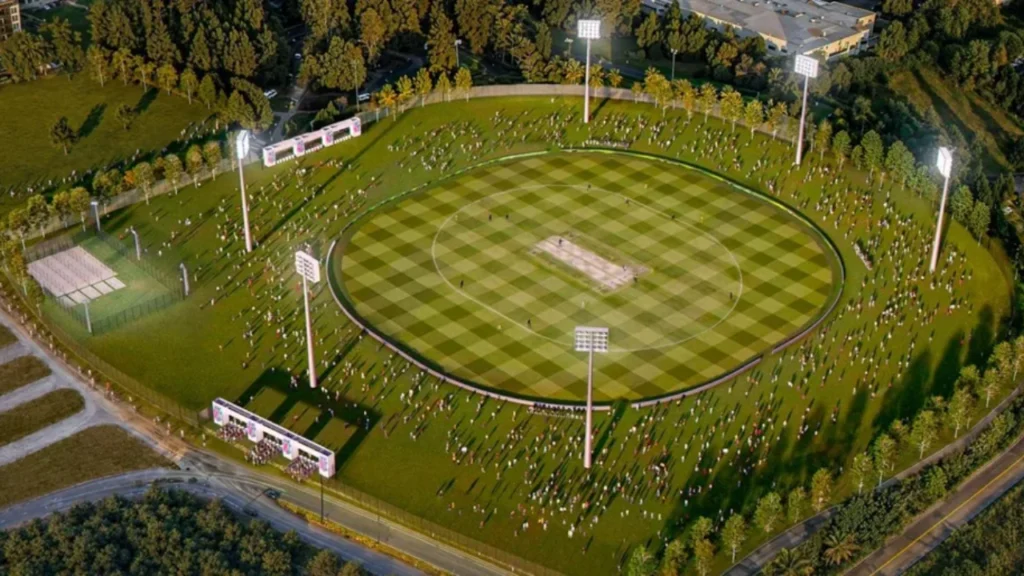 Aerial rendering of the proposed Seattle Orcas Cricket Community Park featuring a full-size cricket ground, floodlights, spectator areas, and surrounding green space.