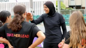 Scotland cricketer Abhata Maqsood leads a Take Her Lead cricket coaching session, encouraging young girls to participate in the sport.