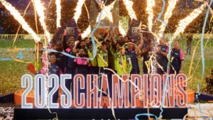 Players celebrate with the trophy after winning the Abu Dhabi T10 2025 championship during the official trophy presentation and champions celebration.