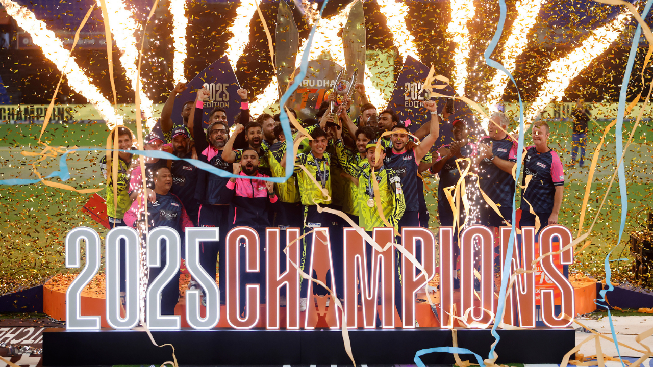 Players celebrate with the trophy after winning the Abu Dhabi T10 2025 championship during the official trophy presentation and champions celebration.
