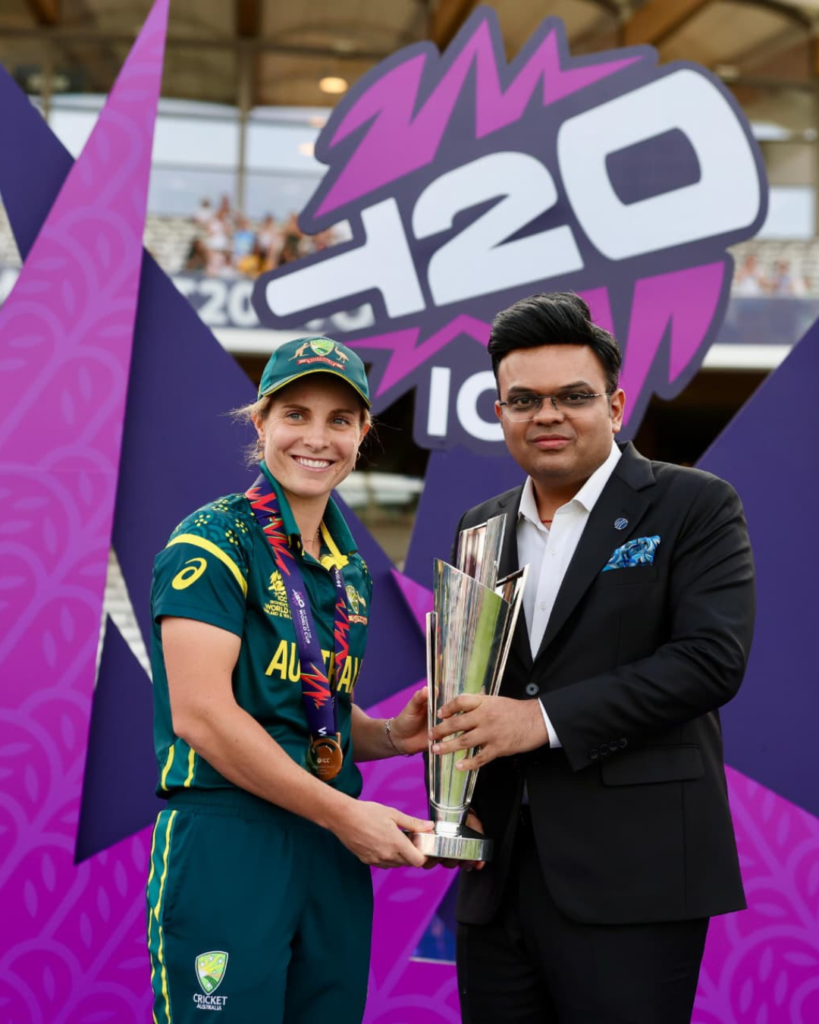 Australia captain Ashleigh Gardner receives the ICC Women's T20 World Cup 2026 trophy from ICC Chairman Jay Shah during the presentation ceremony after Australia's title-winning victory.