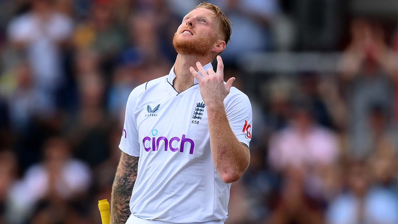 England captain Ben Stokes reacts during a Test cricket match while wearing England's white kit, looking skyward on the field.