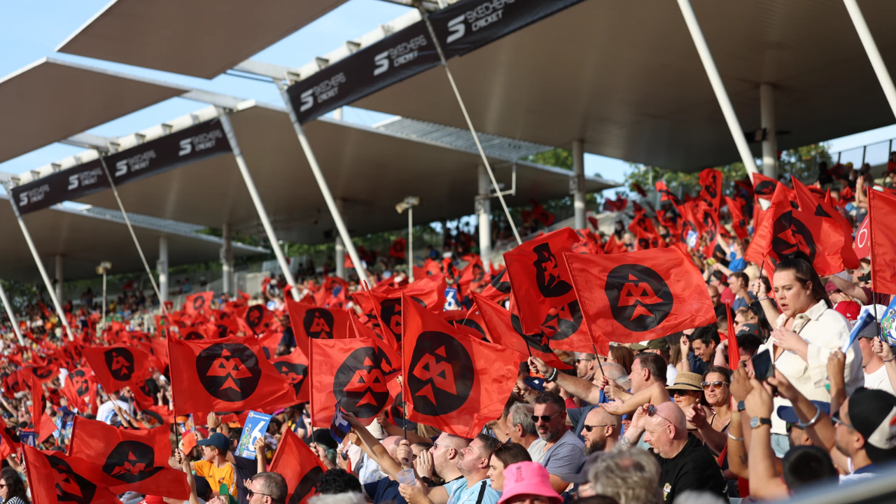 Birmingham Phoenix supporters wave team flags in the stands at Edgbaston during a The Hundred cricket match.