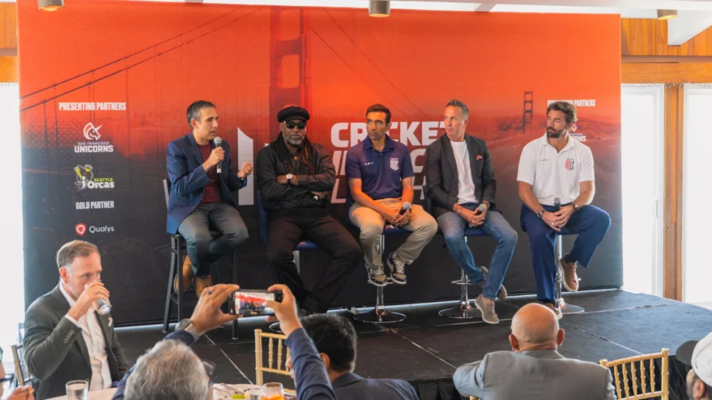 Chris Gayle, Robin Uthappa, Michael Vaughan and Liam Plunkett speak during a panel discussion at the Cricket Impact Summit 2026, sharing insights and stories with attendees.