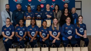 Cricket Namibia women's team players and officials pose for a group photo during a squad announcement and presentation event ahead of the 2026 season.
