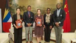CWI CEO Chris Dehring, COO Lynford Inverary, and Coolidge Cricket Ground General Manager Nelecia Yeates pose with representatives from China during an official cricket development and cooperation meeting.