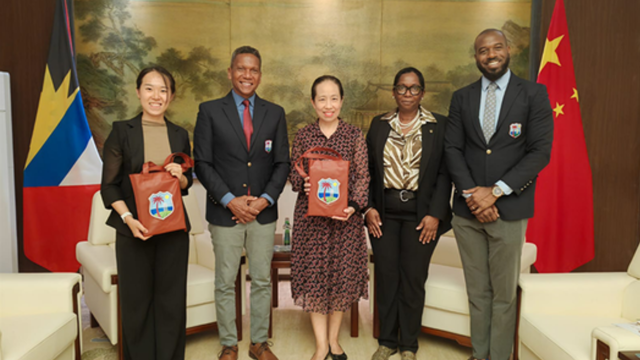 CWI CEO Chris Dehring, COO Lynford Inverary, and Coolidge Cricket Ground General Manager Nelecia Yeates pose with representatives from China during an official cricket development and cooperation meeting.