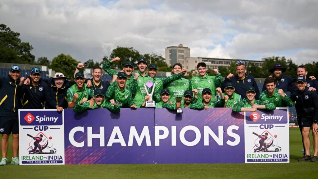 Ireland men's cricket team celebrates winning the 2026 Ireland vs India T20 Series, posing with the Spinny Cup trophy and Champions banner.