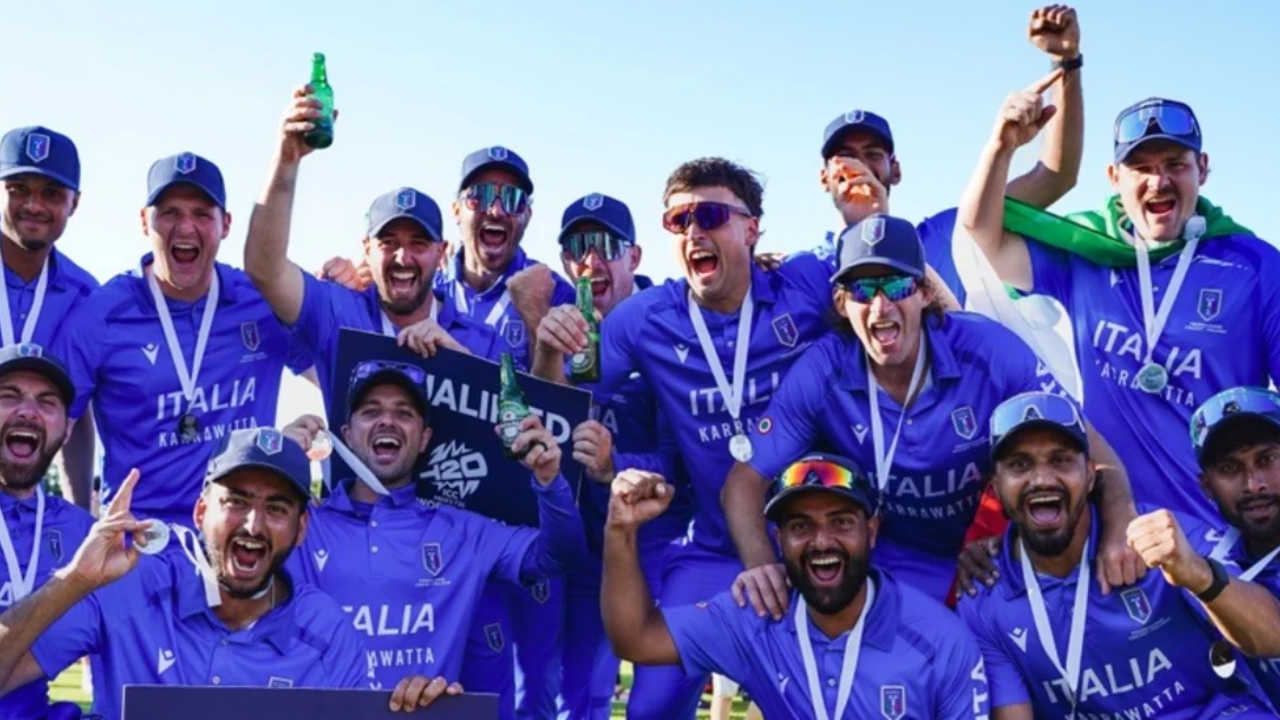 Italy cricket team players celebrate after securing qualification for the ICC Men's T20 World Cup, wearing medals and team jerseys during the post-match celebrations.