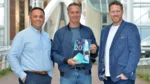 Former England captain Michael Vaughan poses with representatives at the launch of the Leonard Curtis Cricket Finance Report 2026, holding a copy of the report during the official unveiling event.