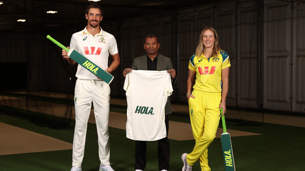 Australian cricketers Mitchell Starc and Ellyse Perry pose with Hola Health co-founder and CEO Lenin Rajendran during the announcement of Hola Health's partnership with Australian cricket.