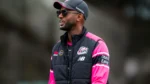 Peter Clarke during a Sydney Sixers training session after being appointed as the club's WBBL head coach, wearing Sydney Sixers coaching apparel and sunglasses.