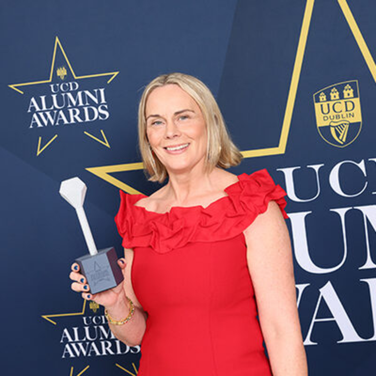 Cricket Ireland CEO Sarah Keane holding the UCD Alumni Award in Law 2025 at the University College Dublin Alumni Awards ceremony.