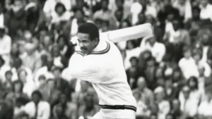 Sir Garfield Sobers plays a batting stroke during a Test match for the West Indies, highlighting one of cricket's greatest all-rounders.