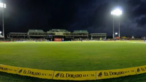 Night view of Sir Vivian Richards Stadium in Antigua during an international cricket match, with floodlights illuminating the ground and spectators in attendance.