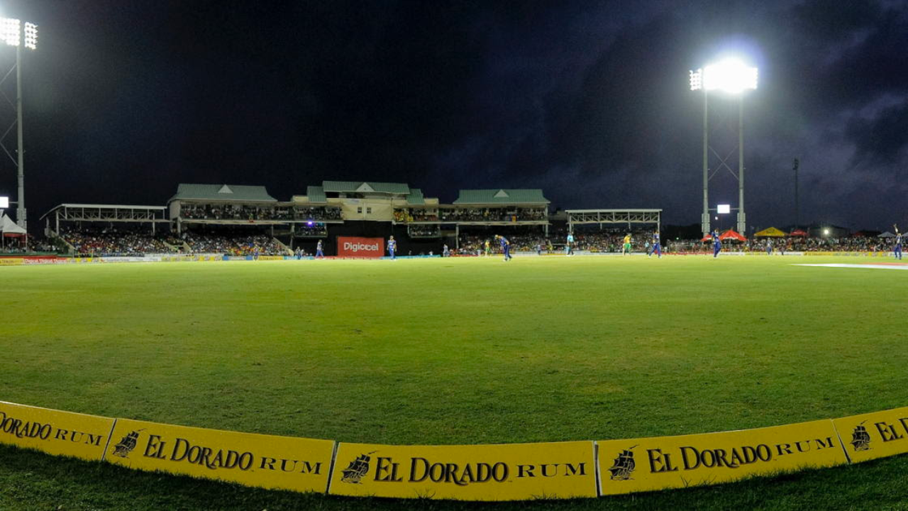 Night view of Sir Vivian Richards Stadium in Antigua during an international cricket match, with floodlights illuminating the ground and spectators in attendance.