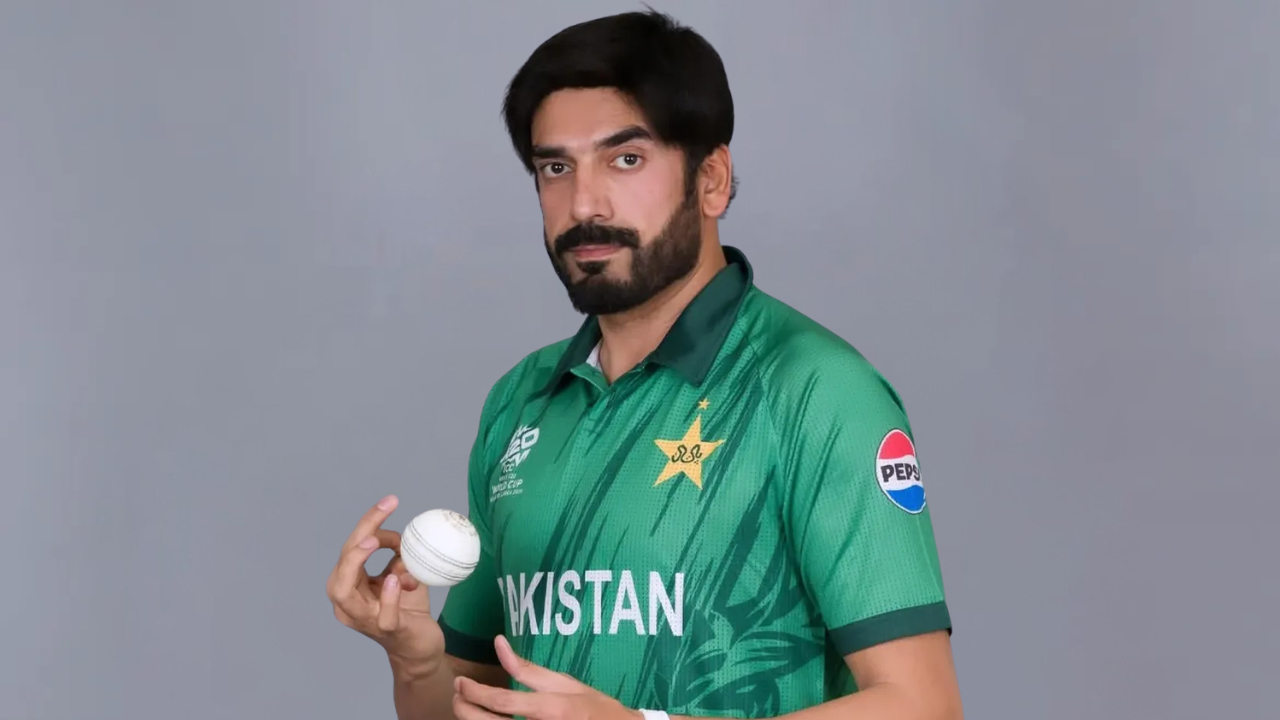 Pakistan cricketer Usman Tariq poses in the national team jersey while holding a cricket ball during an official portrait session.