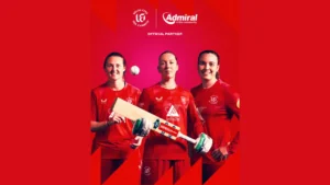 Welsh Fire women’s cricketers promote the team’s official partnership with Admiral in the Community, posing with a cricket bat and ball in team kit.