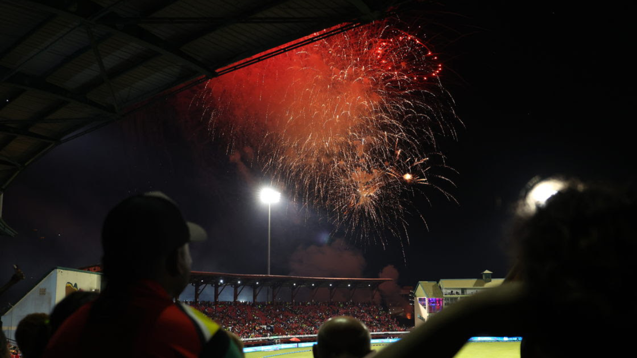 Fireworks illuminate the stadium during the Caribbean Premier League (CPL) opening ceremony as spectators watch from the stands.