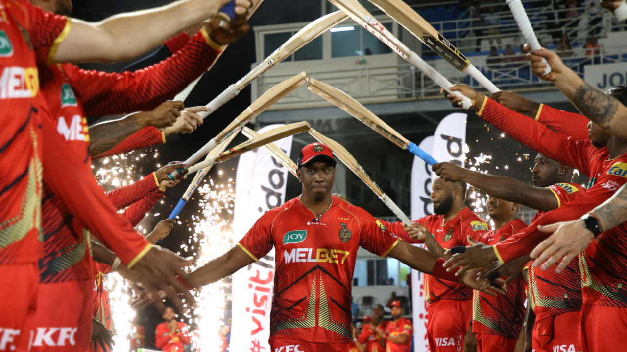 Dwayne Bravo receives a guard of honour from Trinbago Knight Riders teammates during a CPL match