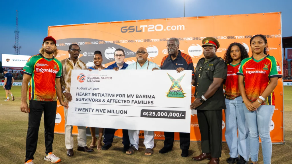 Guyana Amazon Warriors and ExxonMobil Guyana Global Super League officials present a G$25 million donation to the H.E.A.R.T. Initiative supporting survivors and families affected by the MV Barima tragedy at Providence Stadium.