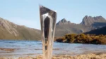 ICC T20 World Cup trophy displayed in front of a mountain landscape