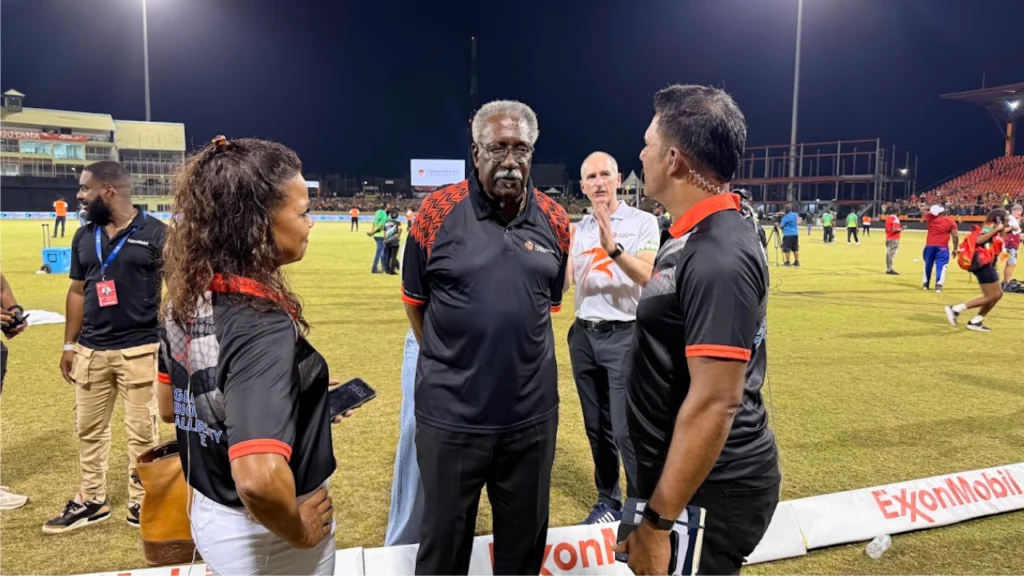 Sir Clive Lloyd, Chairman of the ExxonMobil Guyana Global Super League (GSL), speaks with announcer Alex Jordan and former West Indies captain Daren Ganga during the 2026 tournament in Guyana.