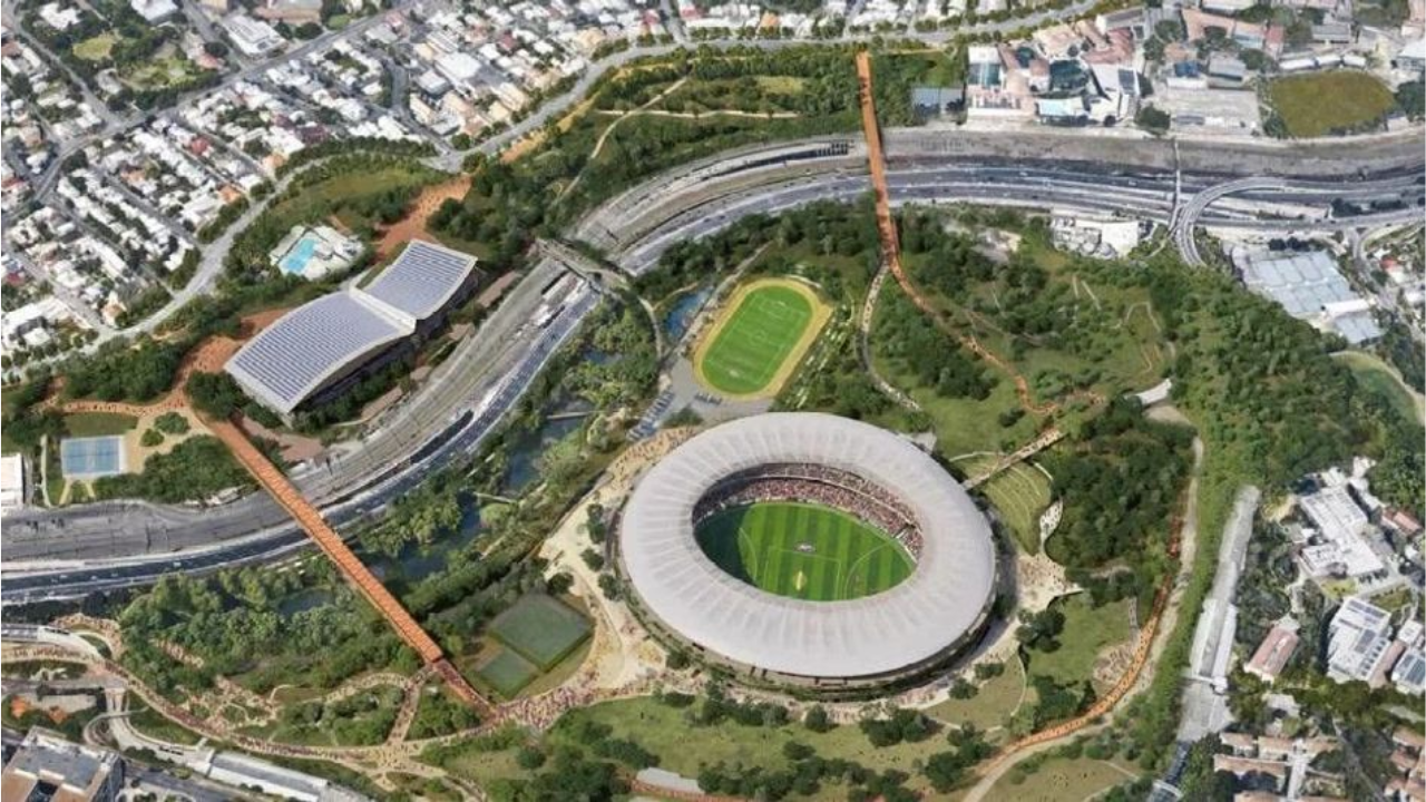 Aerial rendering of the draft Victoria Park masterplan showing Optus Stadium, surrounding parklands, pedestrian bridges, transport infrastructure and proposed urban redevelopment in Perth.