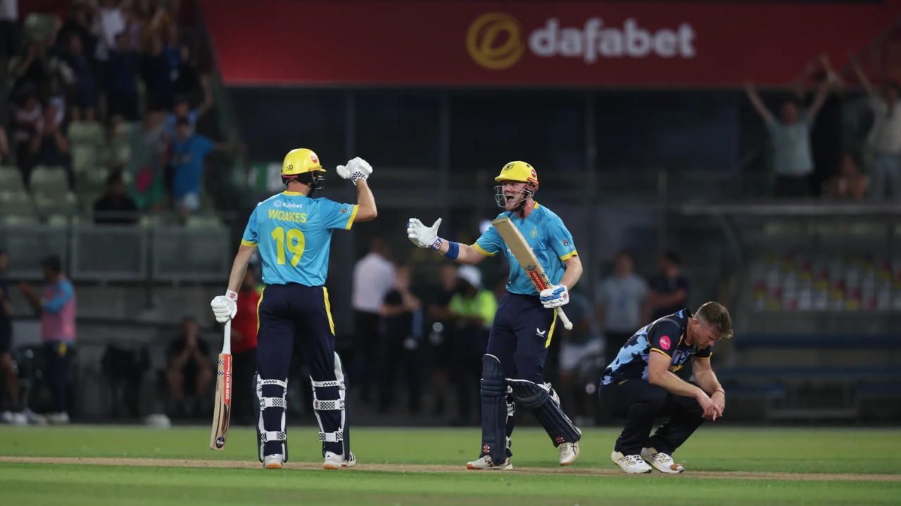 Warwickshire cricketers celebrate during a T20 cricket match.