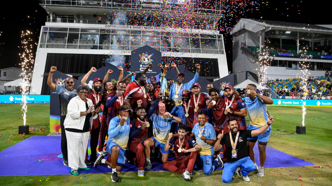 Antigua and Barbuda Falcons celebrate their CPL title win with the trophy