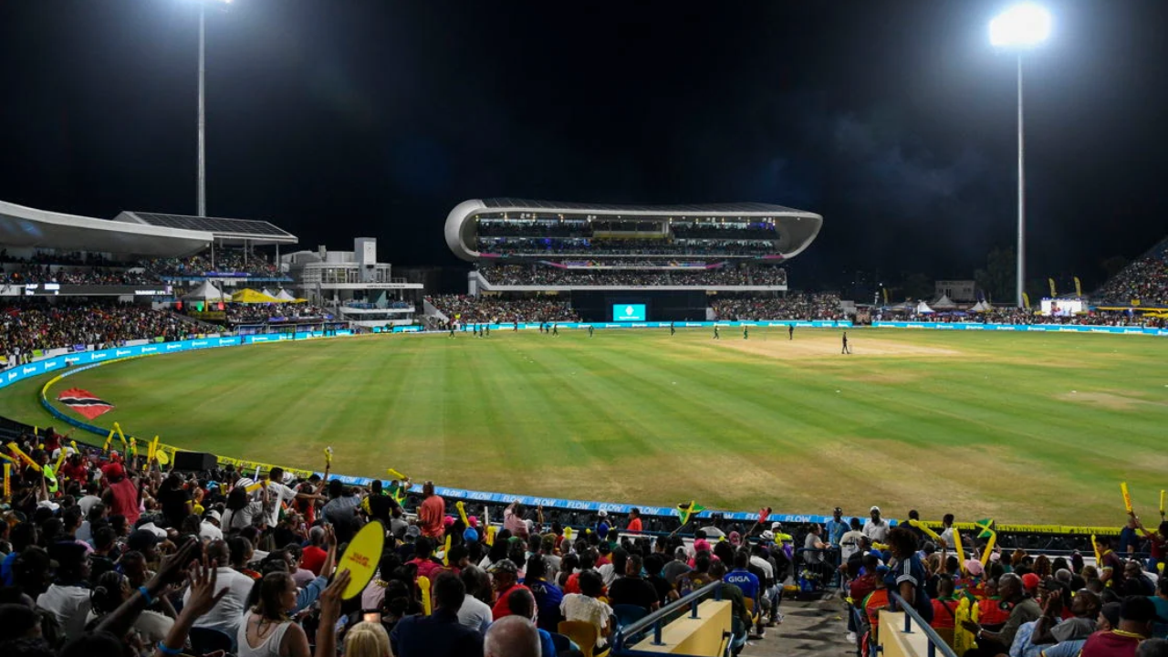 Crowd watching a Caribbean Premier League cricket match under floodlights