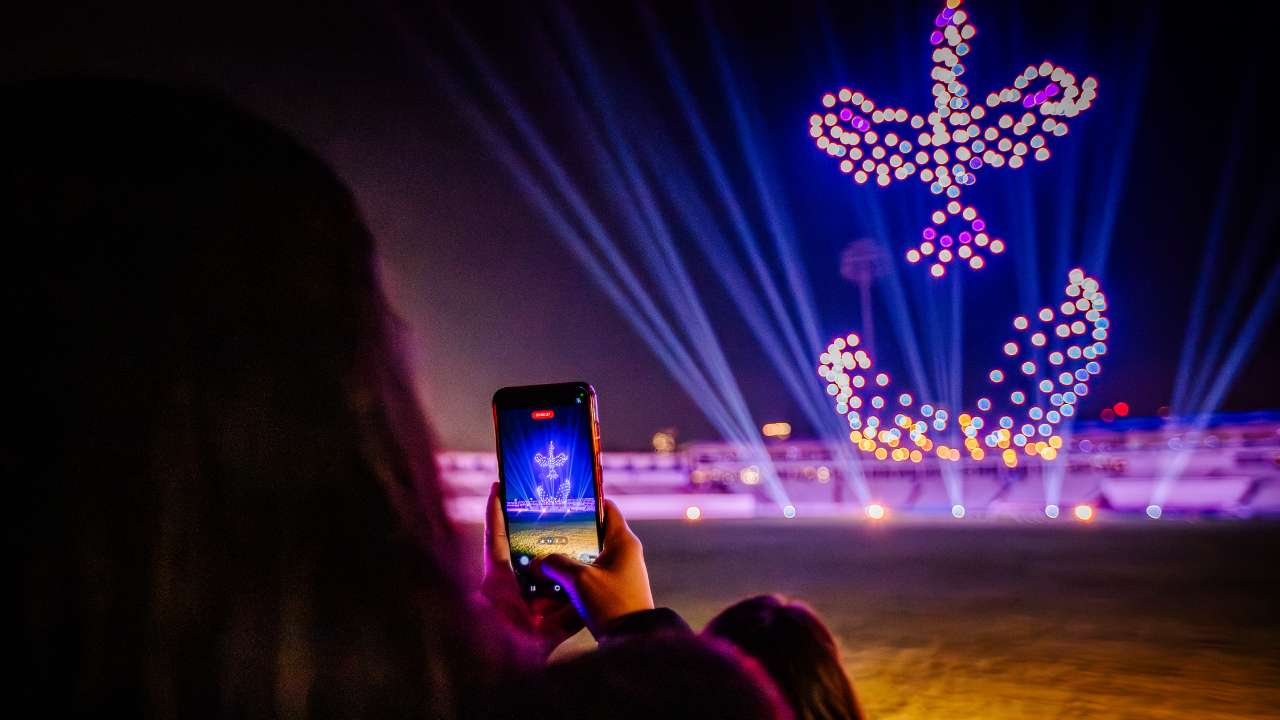 Spectators photograph the first-ever drone light show at Lord’s Cricket Ground