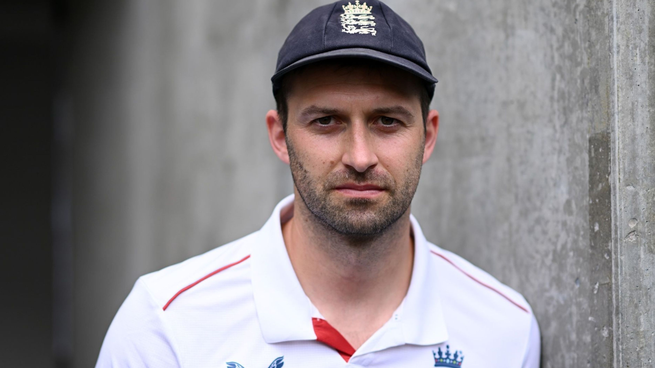 England fast bowler Mark Wood wearing an England cricket cap and Test shirt