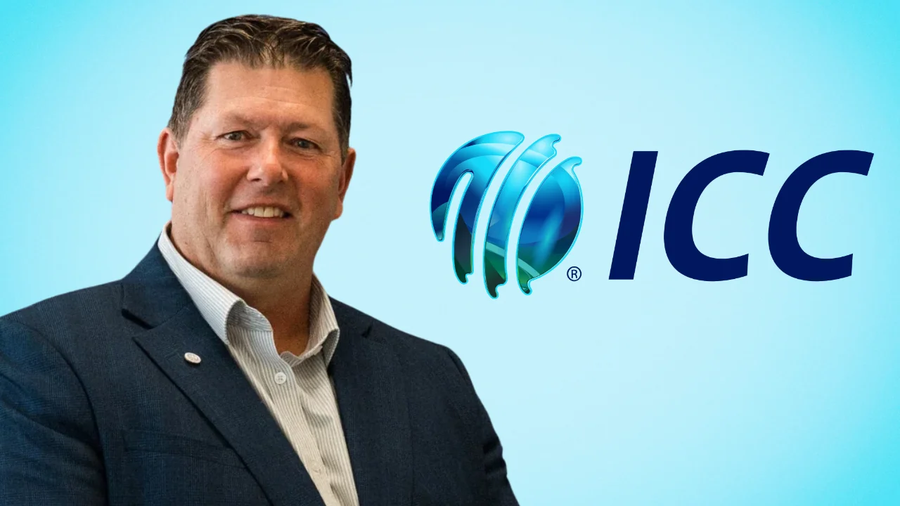 Geoff Allott pictured in a dark blue suit alongside the International Cricket Council (ICC) logo on a light blue background.