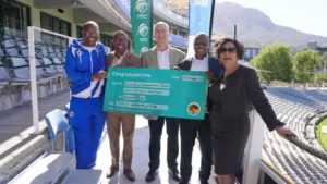 National Lotteries Commission officials present Cricket South Africa with a ceremonial cheque for R65.6 million at Newlands Cricket Ground to fund stadium upgrades ahead of the ICC Cricket World Cup 2027.