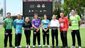 Grace Harris, Adam Zampa, Usman Khawaja, Youi CMO Angela Greenwood, BBL official Phil Rigby and other Big Bash League players at Allan Border Field for the Youi partnership announcement.